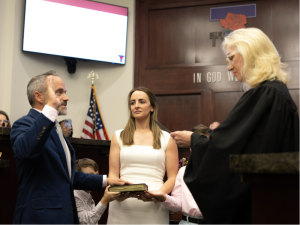 Photographs of City of Tyler Mayor Stuart Hene and Tyler Municipal Court Judge Amy McCullough as Hene is being sworn in as mayor.