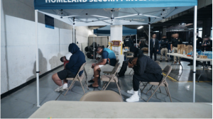 Arrestees wait to be processed and then transferred to U.S. Marshals' custody