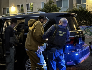 Nakahli Miller being prepared for transport after his arrest